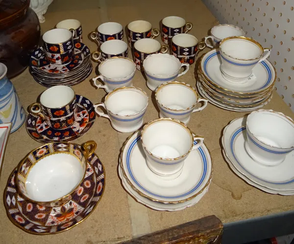 Atlas China; an Imari pattern set, comprising nine cups and saucers and one other, a white porcelain part tea set with blue and gilt borders, includin