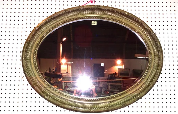 A 20th century gilt framed oval mirror, 65cm wide x 85cm high.   H10