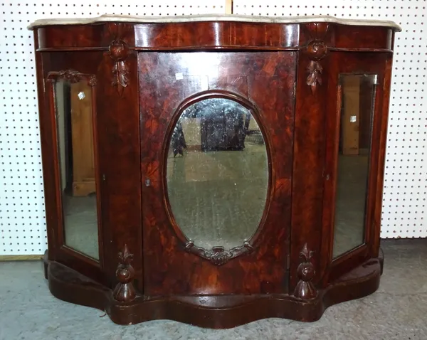 A Victorian walnut serpentine credenza with mirrored panel doors and white marble top, 120cm wide x 85cm high.   C7