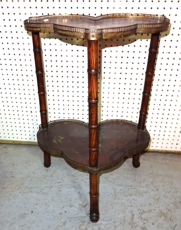 A late 19th century floral painted two tier side table of trefoil form on bamboo downswept supports, 48cm wide x 72cm high.  E8