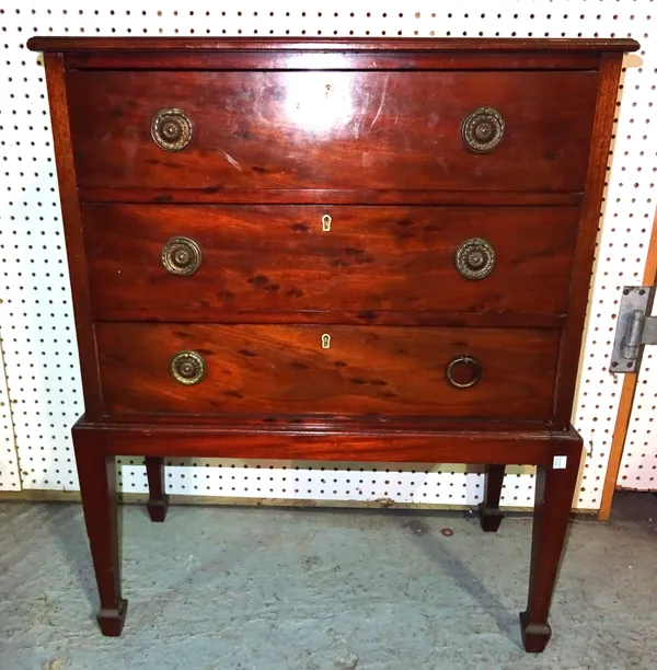 An Edwardian mahogany chest on stand with three drawers on tapering supports, 68cm wide x 85cm high.   E7