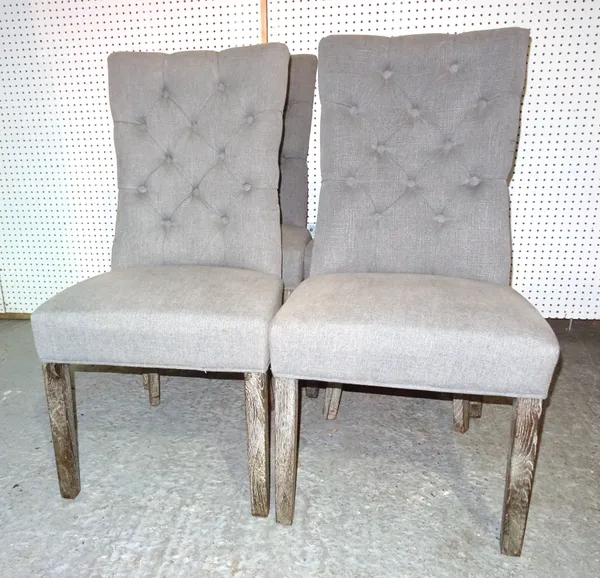 A set of four 20th century limed oak dining chairs with grey button back upholstery, (4).  I8