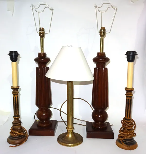 A pair of 20th century mahogany table lamps on reeded tapering columns, 60cm high, another pair of 20th century fluted lamps, 42cm high and a brass fl