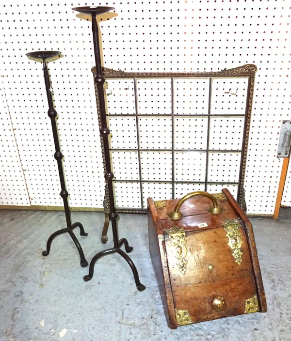 A 20th century mahogany and brass coal purdonium, a brass and glass fire screen 57cm wide x 72cm high and two wrought iron candlesticks, 92cm high, (4