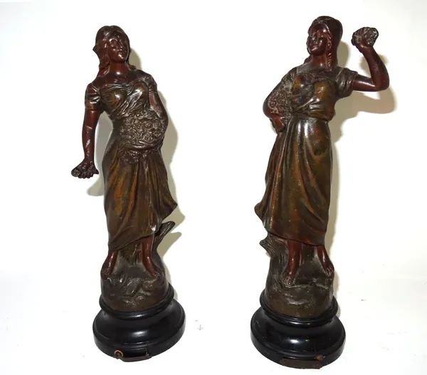 A pair of spelter figures modelled as females, 36cm high.  CAB