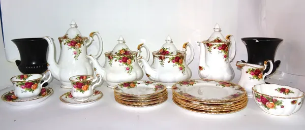 A Royal Albert Old Country Roses pattern part dinner service and a pair of Wedgwood urns, black, (qty).  S2T