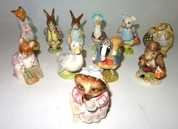 Beatrix Potter; a group of eleven Royal Albert figurines, including Hunca Munca, Flopsy Bunny, Mrs Tiggy Winky and others, (11).  S2M