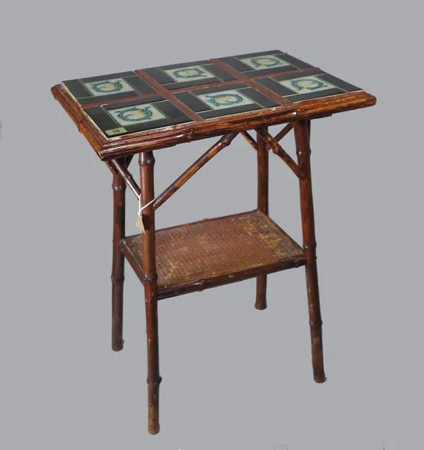 A late Victorian tile top bamboo framed two tier occasional table, six Art Nouveau style tiles inset to rectangular top, 52.5cm wide x 87cm high x 35.