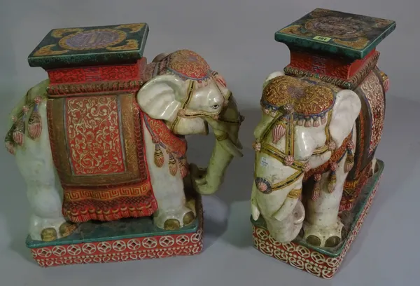 A pair of 20th century ceramic garden seats formed as elephants, 55cm high (2).