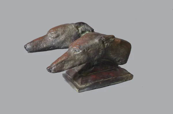 A modern bronzed pottery animalier bust of two greyhound heads, stepped plinth base, 42cm long x 28cm high.