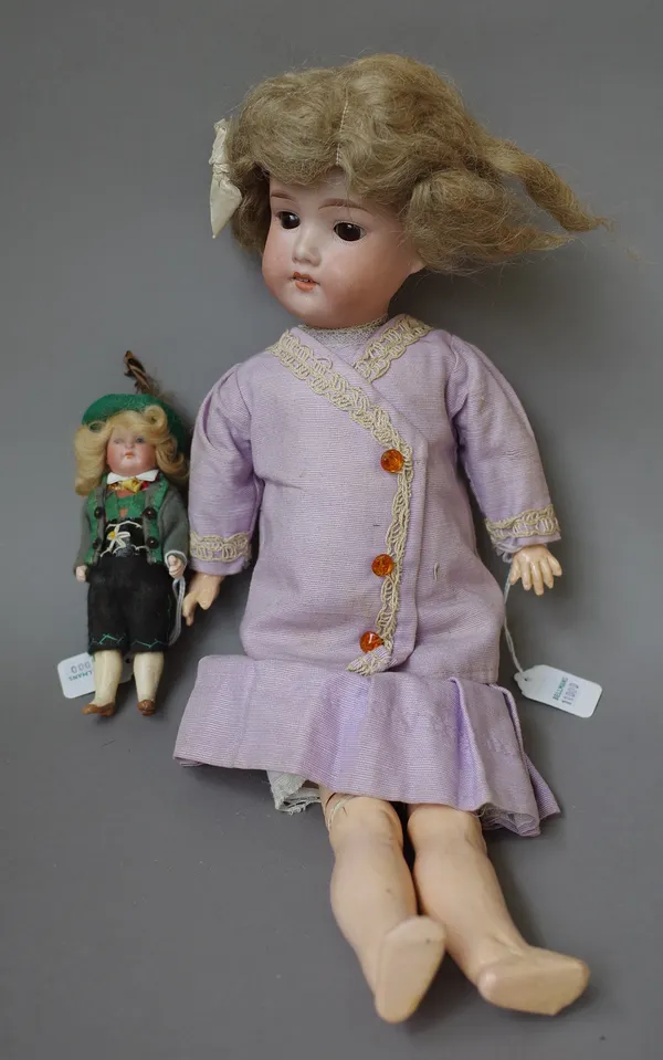 An Armand Marseille bisque head child doll, early 20th century, mould no.390, with sleep eyes, open mouth and jointed limbs, 40cm, and a small German