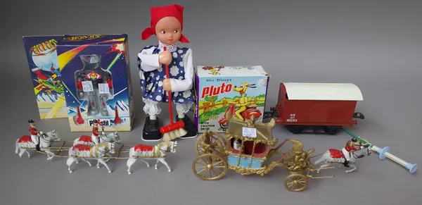 A quantity of collectable toys including; hollow cast lead figures, coronation coach and horses, three O gauge wagons, a polistil Robert Marx Pluto on