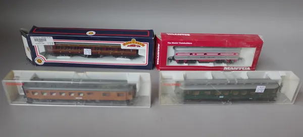 A quantity of OO gauge coaches, wagons and related accessories including; Bachmann, Mantua, Rivarossi, Luma, Fleischmann, Hornby and others, mostly bo