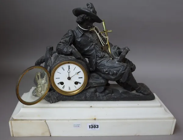 A late 19th century French bronzed spelter and simulated white marble eight day mantel clock with reading knight figural surmount, 42.5cm wide.