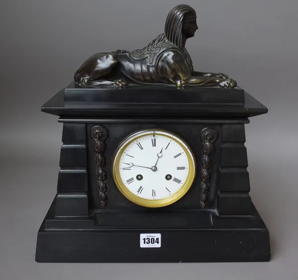 A French black marble and bronze mounted mantel clock, late 19th century, with 'Sphinx' surmount and foliate embellishments, enclosing a two train mov