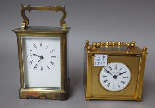 A brass cased carriage clock, early 20th century , with visible Brocot escapement, white enamel dial and a single train movement, 10.5cm high, in a le