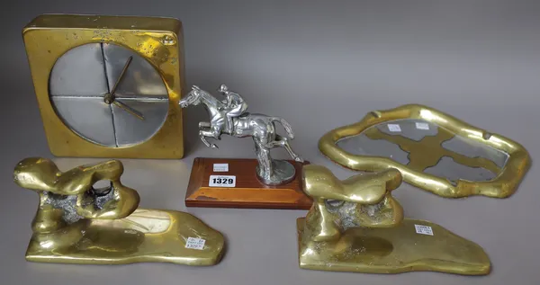 A silver plated car mascot modelled as a jumping racehorse, 12cm high, a pair of gilt bronze bookends of stylised contemporary form, 20cm wide, a bron