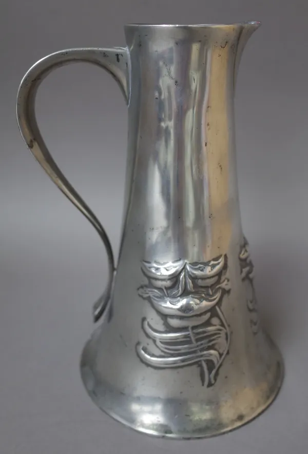 A Liberty Tudric pewter water jug, after a design by Archibald Knox, decorated with relief stylised flowers against a tapering circular body, no. 028,