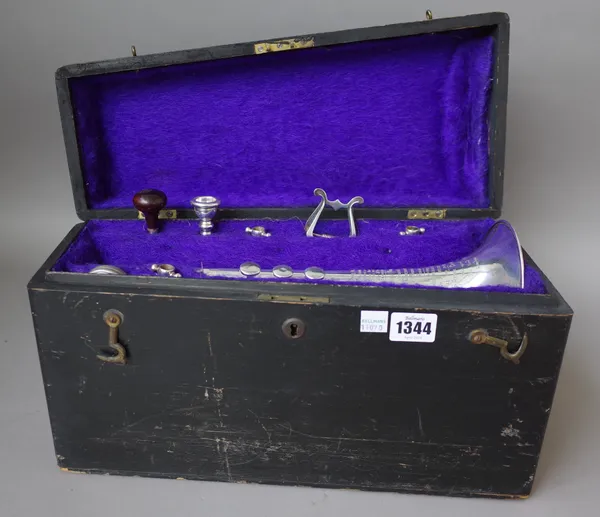 A French silver plated Cornet by Antoine Courtois, with accessories in original ebonised wooden case.