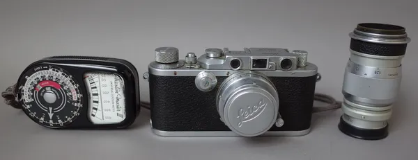 A Leica D.R.P. camera with Summar 5cm lens, an Elmar 9cm lens, a Leitz 9cm view finder and a Weston 'Master 3' light meter.