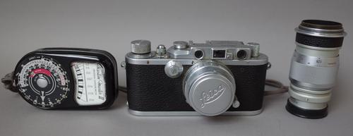 A Leica D.R.P. camera with Summar 5cm lens, an Elmar 9cm lens, a Leitz 9cm view finder and a Weston 'Master 3' light meter.
