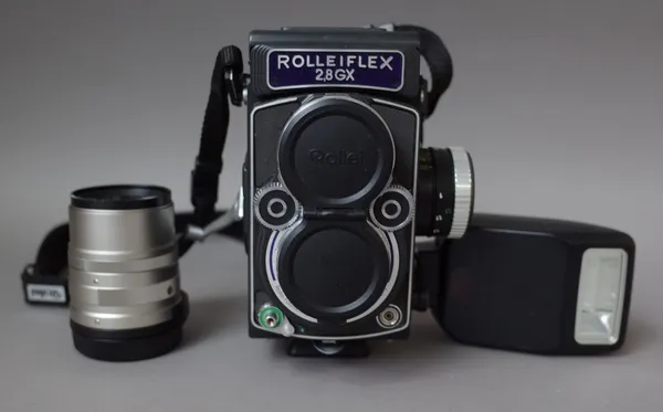 A Rolleiflex 2.8 GX 'Expression' medium format camera, circa. 1995, with a speedlite 200E flash, planar 1:28 80mm lens, No. 8119931 and a separate Car