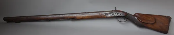 An early 19th century percussion combination hunting rifle with removable rifled barrel, indistinctly signed, 125cm overall. (a.f.)