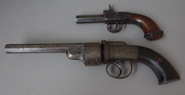 An early 19th century Continental percussion action six shot revolver pistol, with hexagonal barrel foliate engraved decoration and two piece chequere