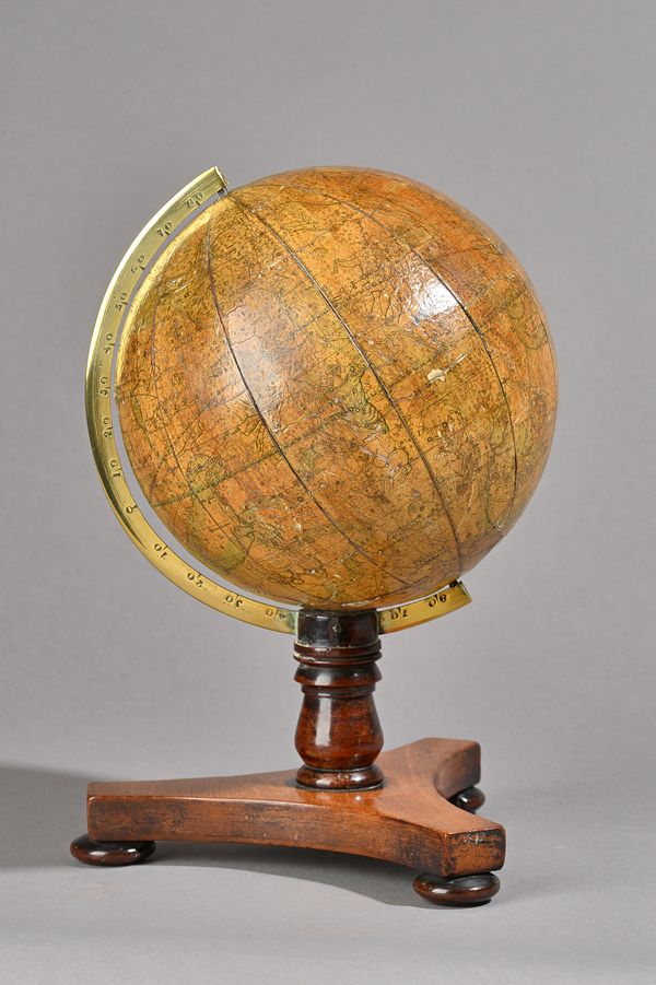 A Bale & Woodward six inch celestial globe, probably mid-19th century, on a mahogany tri-form stand, 27cm high. Illustrated.