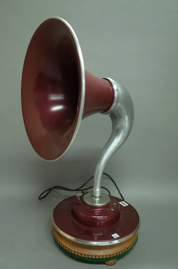 A J.S Stevens 1950s gramophone (converted) table lamp, raised on a later wooden plinth, 66cm high.