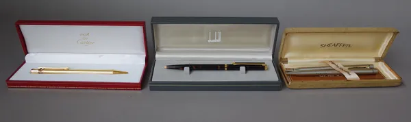 A Must de Cartier gilt metal ball point pen, cased, a Dunhill ball point pen and further 'Cross' pens, (qty).