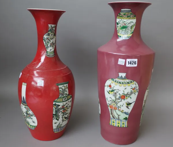 Two modern Chinese red ground vases each decorated with panels of famille vert vases, six character marks to base, 45.5cm high, (2).