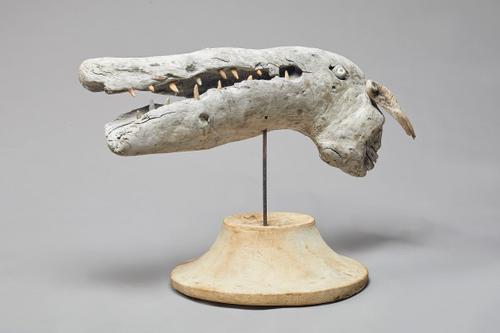 Martin Scorey 'Grotesque Beast', naturalistic driftwood and inset pebble on a turned circular wooden base, 70cm wide x 54cm high. DDS