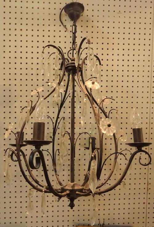 A modern patinated metal four branch chandelier of open frame form hung with cut glass drops, 60cm high.