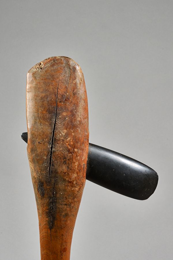 A Papua New Guinea hardstone mounted wooden axe with oversized naturalistic handle, 71cm.