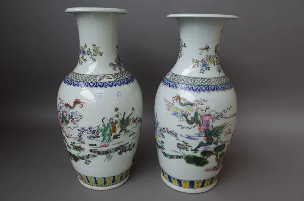 A matched pair of modern Chinese vases, each famille verte decorated with figures in a landscape, six character mark to base, 43.5cm high, (2).