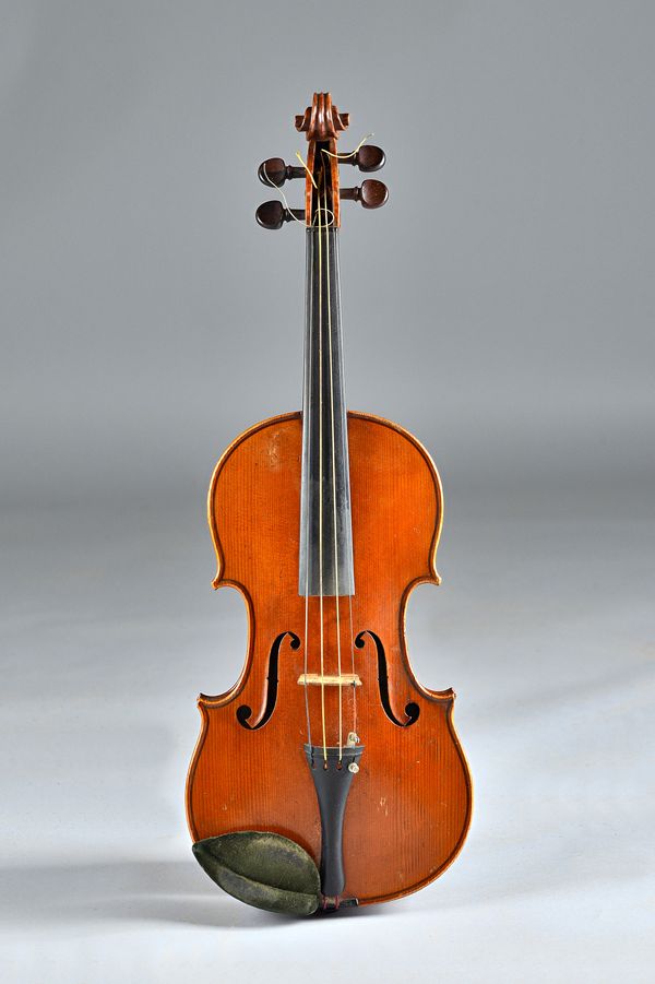 A violin, interior paper label reads 'Lutherie Artistique, Jean Baptiste Colin, Anne 1861 JB-C' length of back 14 1/8 inch, with bow and case. Illustr