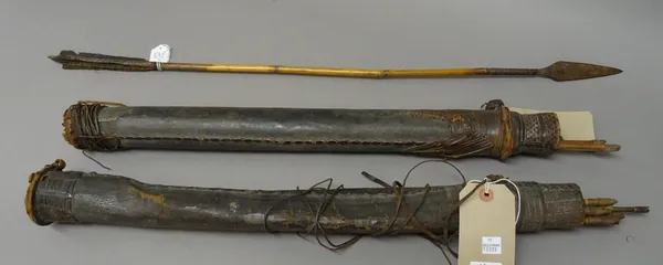 A quantity of African bamboo arrows with steel tips, held in two leather quivers (Qty.).