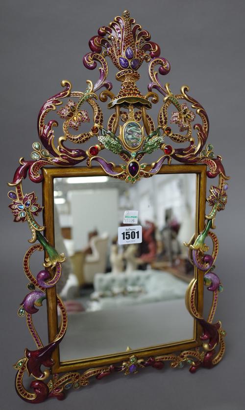 Jay Strongwater; a gilt metal and enamel strut back photograph frame, foliate design, limited edition 86/250, dated 2010, 48cm high x 30cm wide.