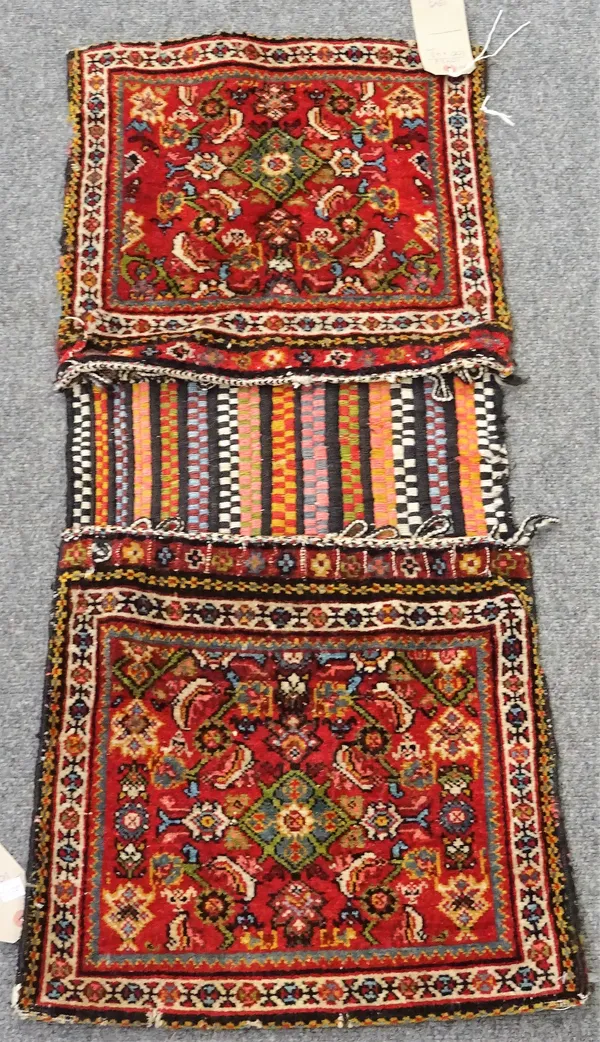 A South Persian saddlebag, the two madder bag covers each with Herati design, 100cm x 43cm.