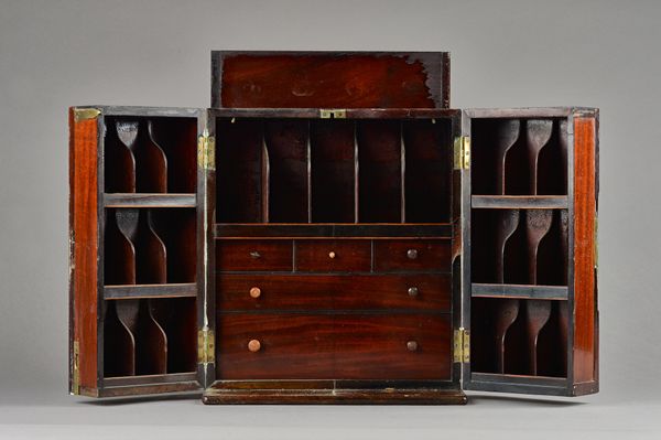 A Regency mahogany apothecary box, the lift top enclosing four bottles, the pair of double front doors enclosing a compartmented interior, 30cm wide x