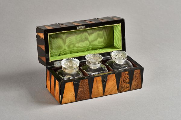 A 19th century French specimen wood deceptive "tumbling cube" parquetry inlaid rectangular box enclosing a three bottle interior, 18cm wide x 9cm high