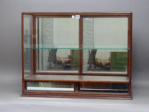 A 19th century mahogany framed table top display cabinet with a pair of mirror fronted lower drawers, 81cm wide x 63cm high.