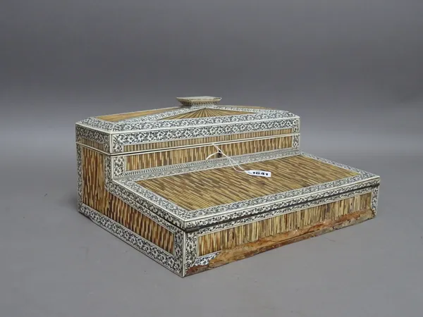 A 19th century Anglo-Indian ivory and porcupine quill writing slope, the lift top with fitted interior over fold-out writing surface, 36cm wide x 16cm