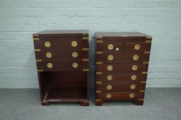 A pair of campaign style brass bound mahogany bedside tables, each with brushing slide over two short and five long drawers, on bracket feet, 46cm wid