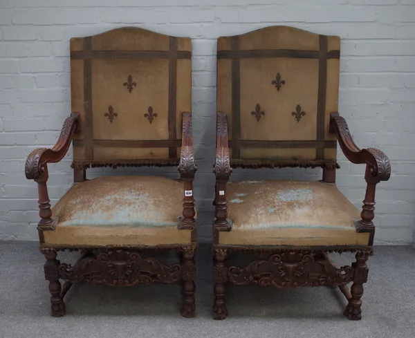 A pair of 19th century walnut framed hump back open armchairs of 17th century Flemish design, 64cm wide x 120cm high. (2)