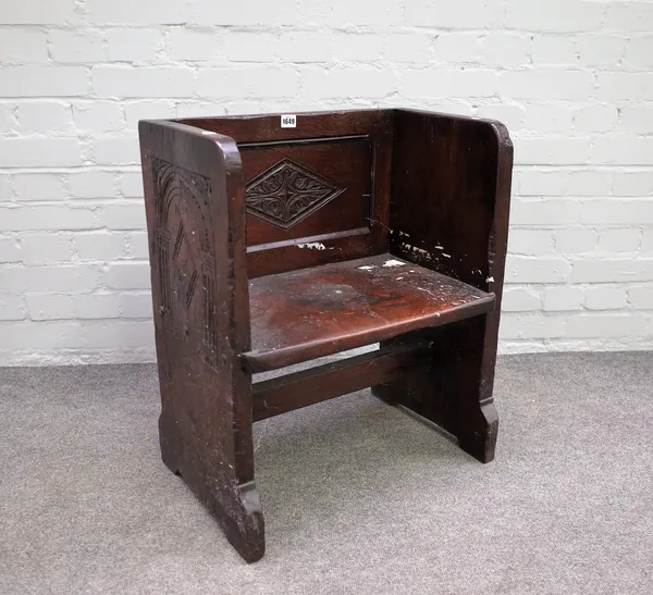 A Charles I and later oak inglenook box back stool, on slab end supports, 56cms wide, 67cms high.