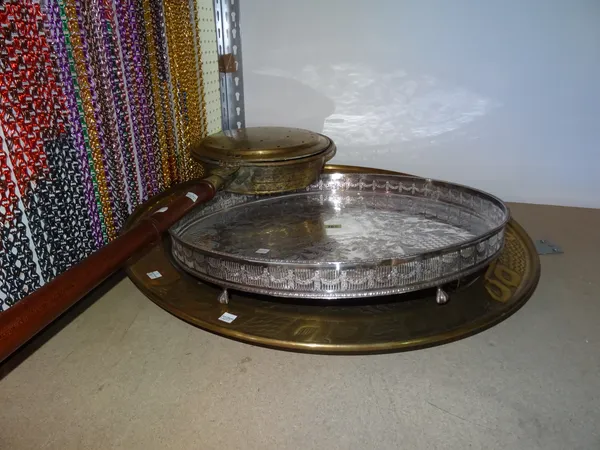 Collectables, comprising; a brass circular tray, 74cm wide a silver plated circular tray with galleried top on claw feet 57cm wide and a Victorian bra