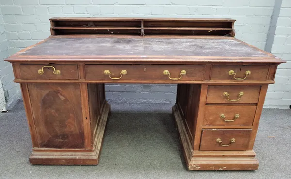 A late 19th century mahogany pedestal desk, with fitted superstructure over nine frieze drawers, 153cm wide x 75cm high.