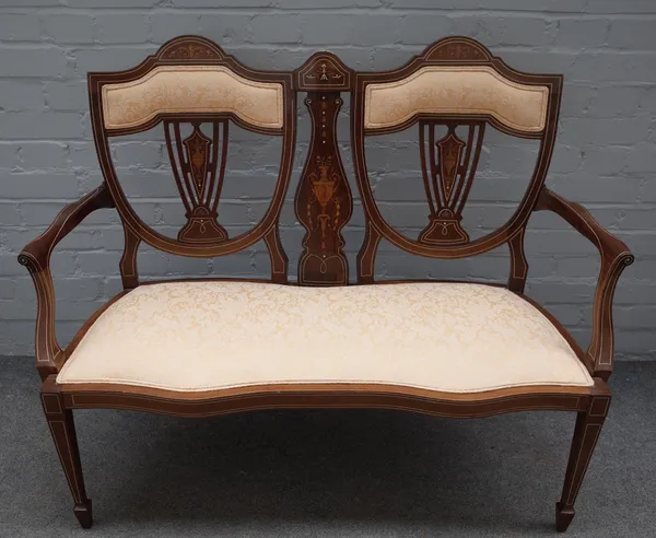 An Edwardian marquetry inlaid mahogany double chair back show frame sofa, on tapering square supports, 120cm wide x 94cm high.